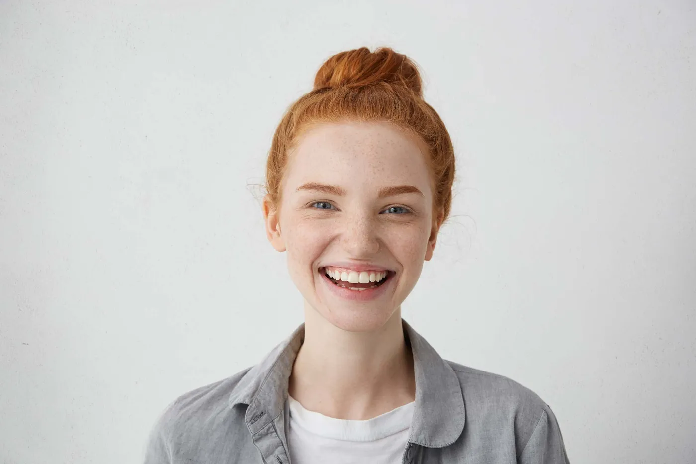 Woman laughing with a natural, healthy smile